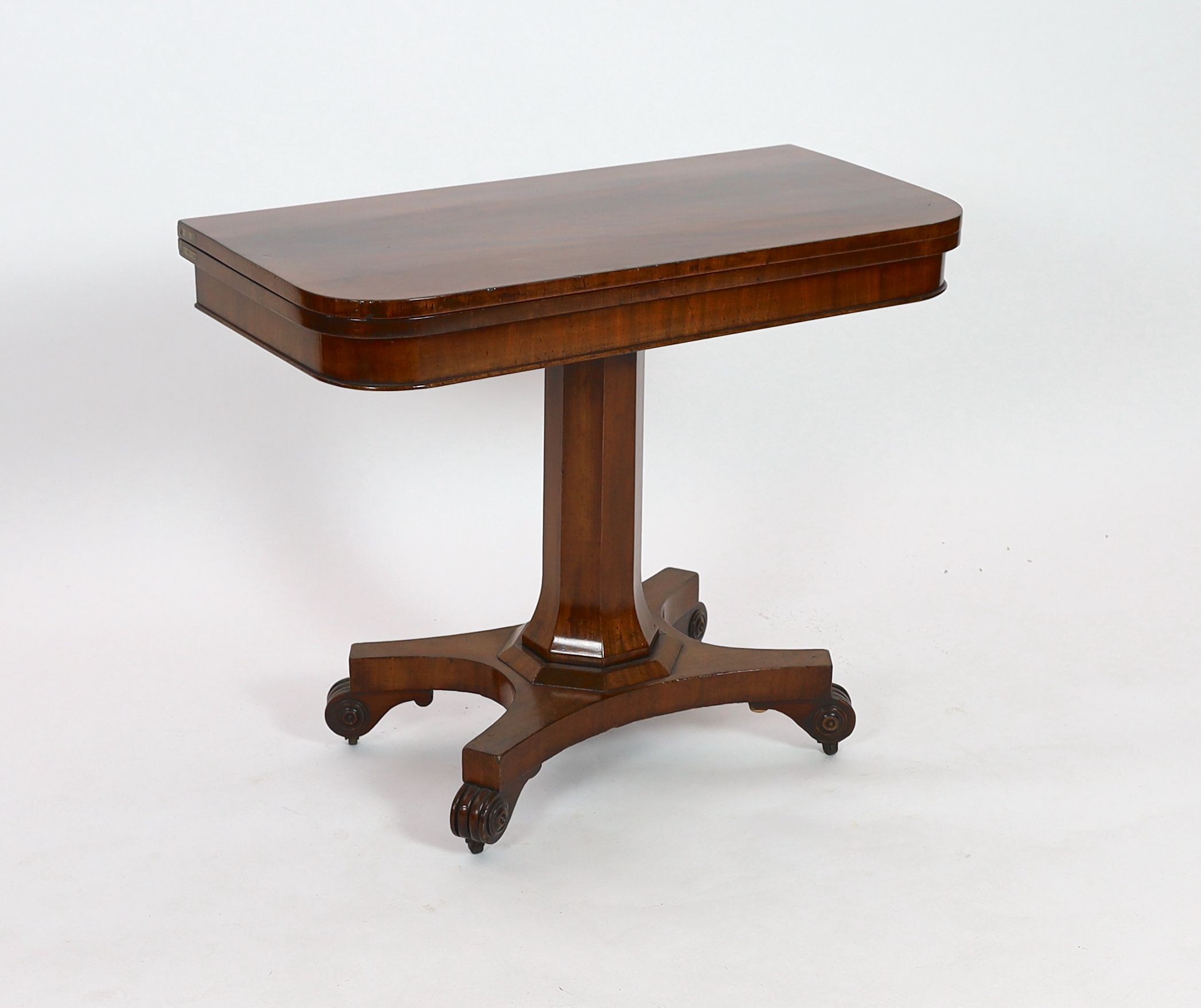 An early Victorian rectangular mahogany folding card table, on octagonal column, width 90cm depth 44cm height 74cm